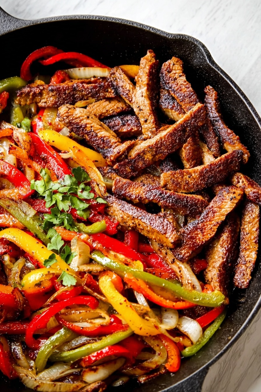 The image shows a black cast iron pan with two main layers: on one side, dark brown strips of cooked meat with a slightly crispy texture, and on the other side, bright red, yellow, and green bell pepper strips mixed with onions, all lightly cooked with a soft texture. A few small green leafy herbs are scattered on top for garnish. The pan sits on a white marbled surface. photo taken with an iphone --ar 2:3 --v 7