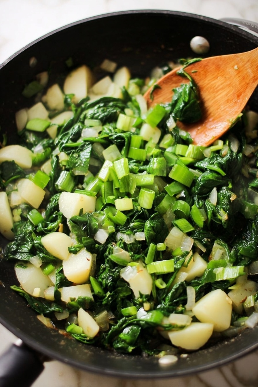 A slice of frittata sits on a white square plate, showing three main layers: a light golden-brown top with a slightly crispy texture, a middle layer filled with green spinach pieces, and a bottom layer with white potato chunks. The frittata slice reveals the mix of eggs and vegetables inside, with some browned edges visible. In the background, a black skillet containing the rest of the frittata is slightly out of focus, placed on a white marbled surface. A fork rests near the frittata slice on the plate, shiny and silver. photo taken with an iphone --ar 2:3 --v 7